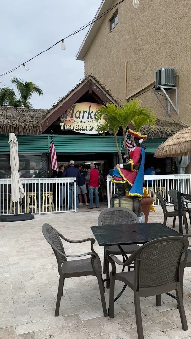 Casual bar area with tropical decor.
